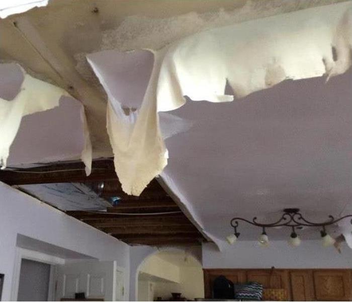 Caved ceiling from broken pipe