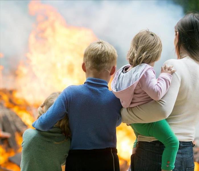 Family looking at a Burning House