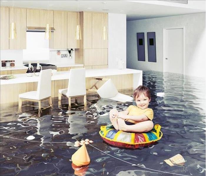 Child in a flooded home. 